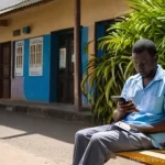 감비아 여행자 보험 필요성 - **Prompt:** A concerned yet composed Spanish tourist, appearing to have a mild fever or discomfort, ...